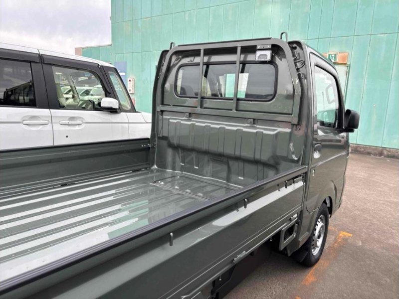 Drop-side steel load bed